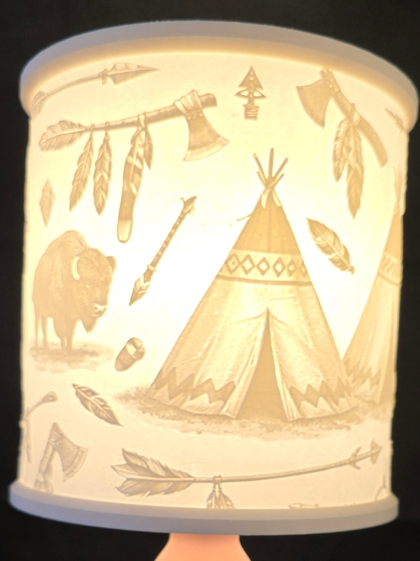 Decorative lamp with tribal design on a black background