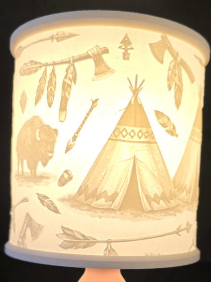 Decorative lamp with tribal design on a black background