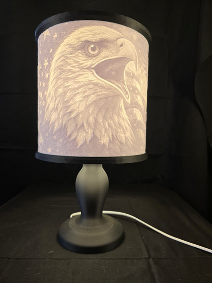 Decorative lamp with an eagle design on a black background